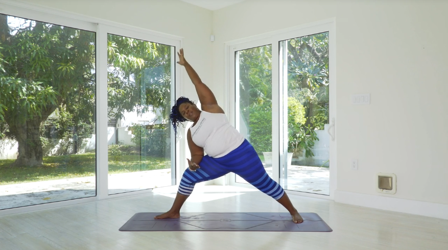 Dianne wears striped blue leggings in side angle pose.